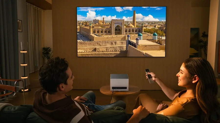 Person enjoying immersive sound experience while watching entertainment in a comfortable home theater setup