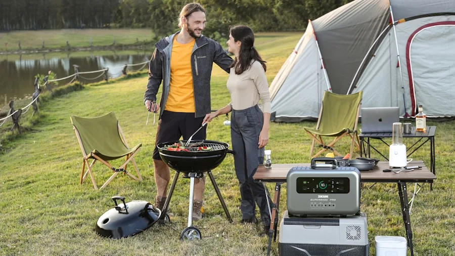 Person enjoying music outdoors during camping trip with portable speaker in natural setting