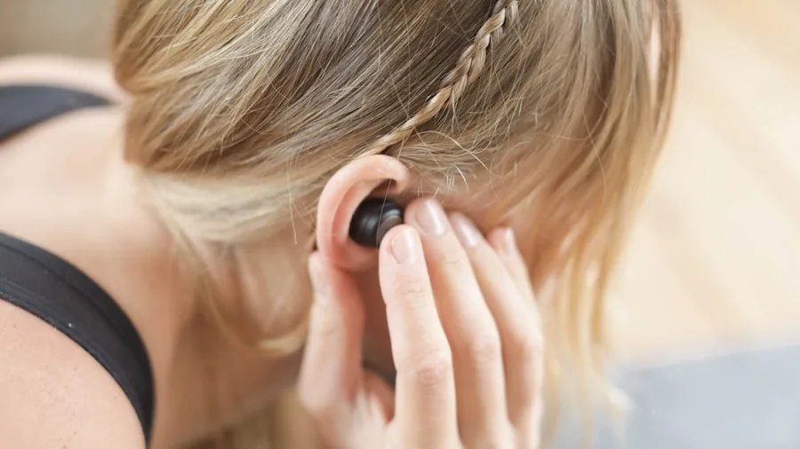 Person enjoying music with comfortable wireless earbuds during daily activity