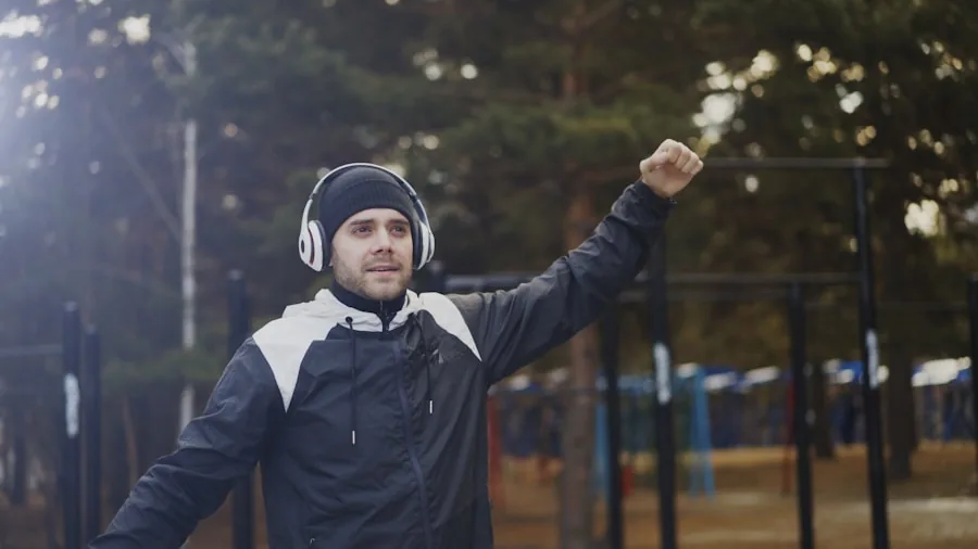 Person enjoying music with earbuds in a natural outdoor setting, representing audio quality and listening experience