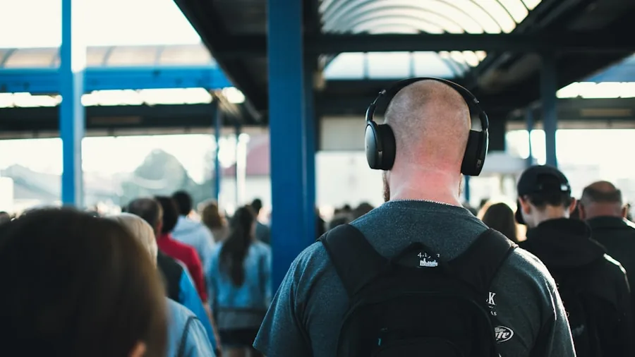 Person enjoying music with headphones during daily commute, representing affordable audio options