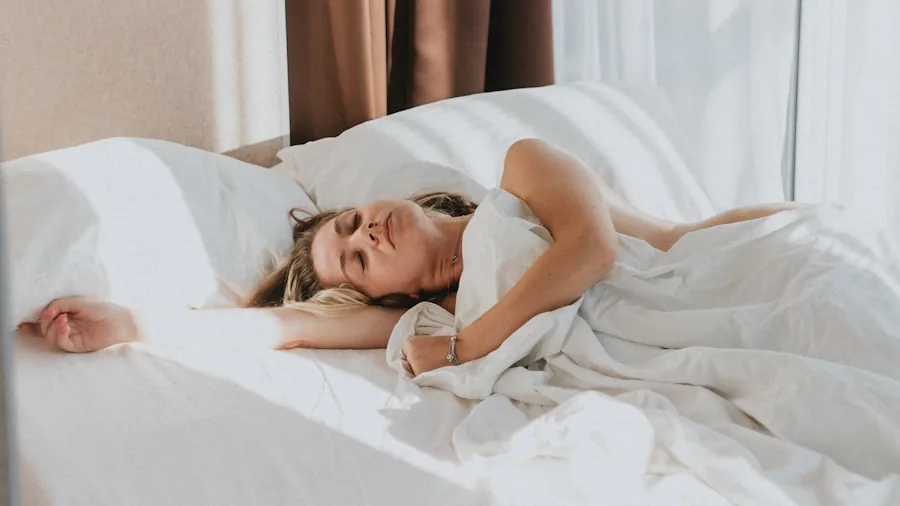 Person enjoying restful sleep on a comfortable bed in a bright, minimalist bedroom