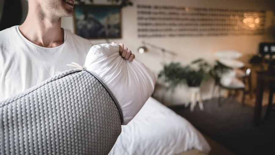 Person evaluating pillow quality and comfort during sleep testing at home