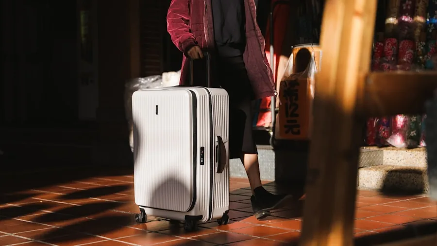 Person examining carry-on luggage material and construction quality before trip
