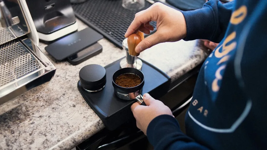 Person examining coffee capsules in modern kitchen, deciding between options for their machine