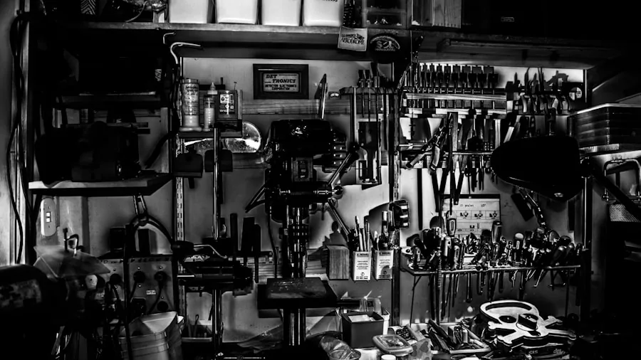 Person examining tools in workshop, considering options for a DIY project
