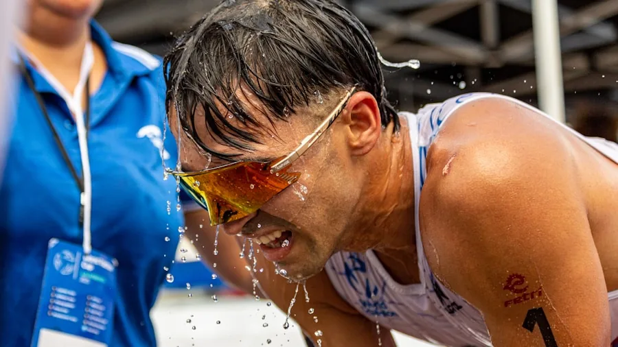 Person exercising intensely with sweat, demonstrating durability needs for active lifestyle gear