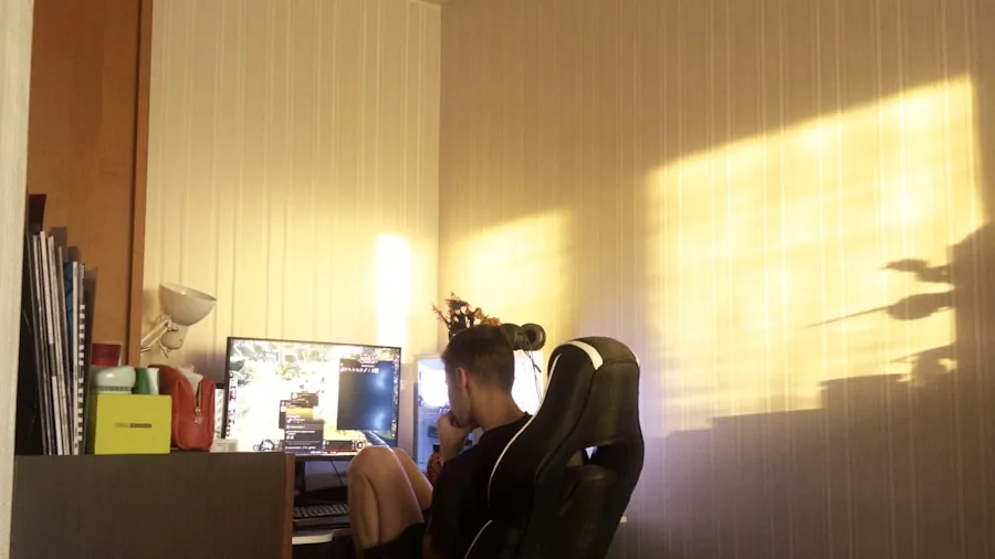 Person experiencing discomfort while sitting in gaming chair for extended period