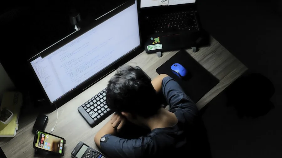 The %product_count% Best Monitors 5 Person experiencing eye strain while working on computer during evening hours, holding glasses