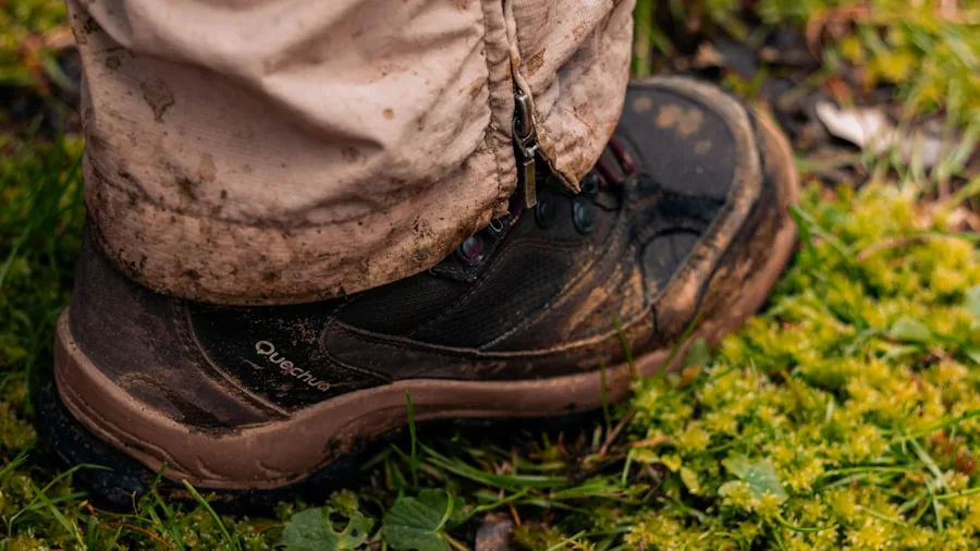 The %product_count% Best Trekking Boots 2 Person fitting hiking boots while sitting outdoors on a trail before a trek