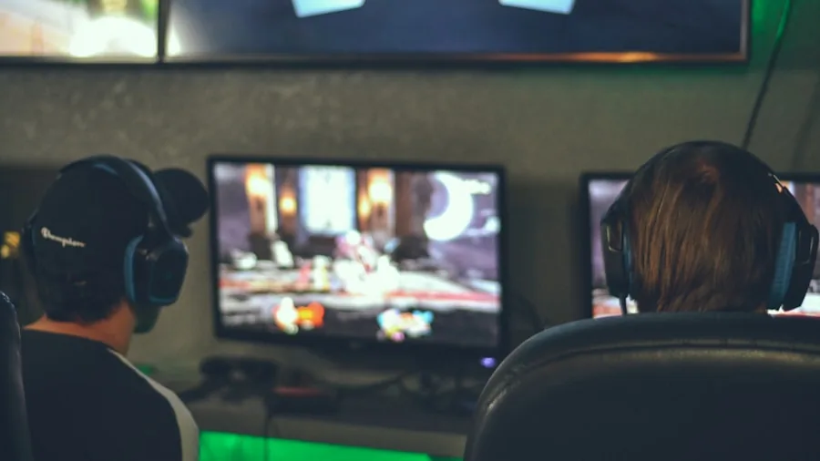 The %product_count% Best OLED Monitors 3 Person gaming on high refresh rate monitor with fast-moving action displayed on screen