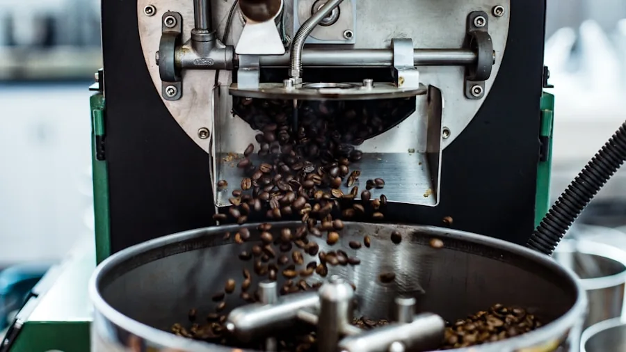 Person grinding fresh coffee beans in morning kitchen light with aromatic steam rising