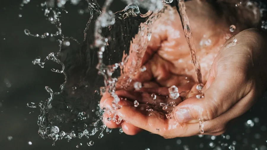 Person hand washing a nonstick pan with soft sponge and soapy water in kitchen sink