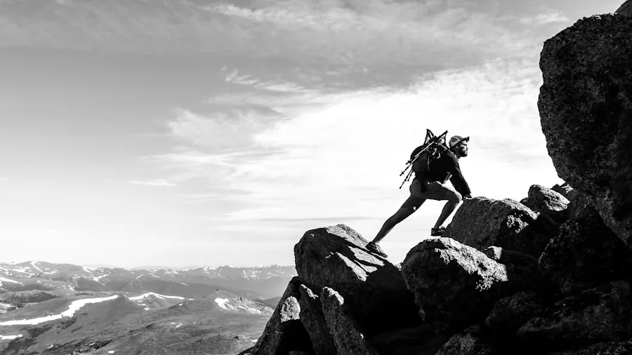 The %product_count% Best Hiking Boots 5 Person hiking on mountain trail wearing full backpack on scenic landscape