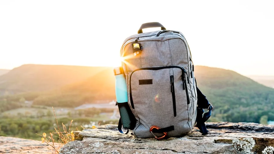 Person hiking with backpack in nature, representing portable gear for active lifestyles
