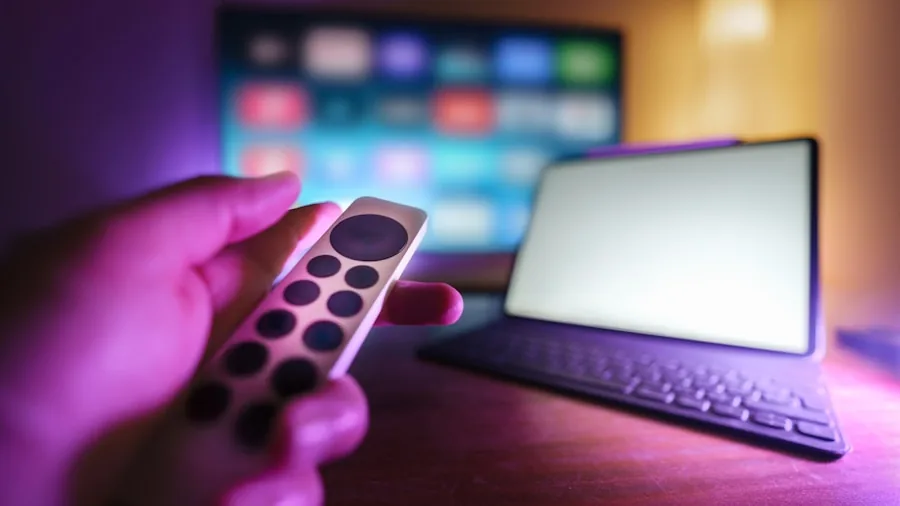 ExpressVPN Now Available for Fire TV Stick: What Shoppers Need to Know 2 person holding remote control television