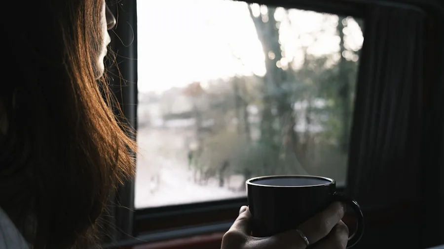 Person holding warm beverage during morning commute journey