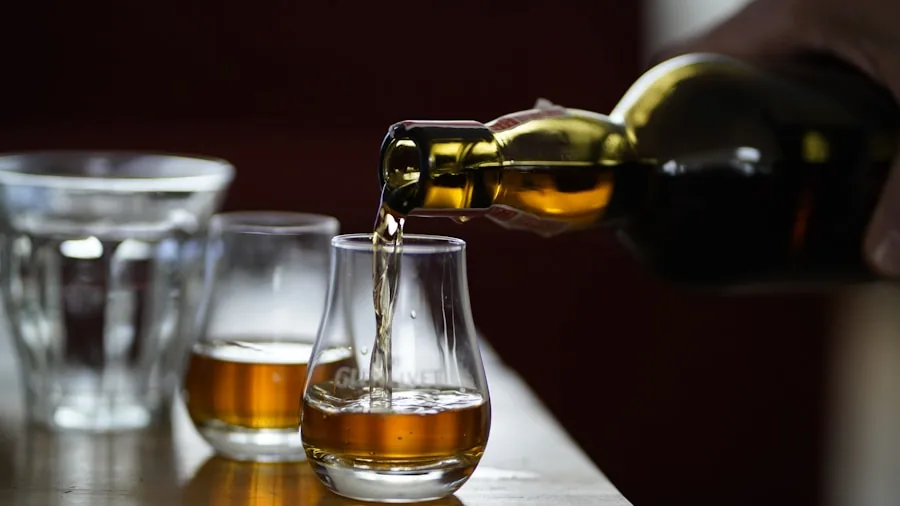 Person holding whiskey glass close to nose while tasting, focusing on the sensory experience of whiskey