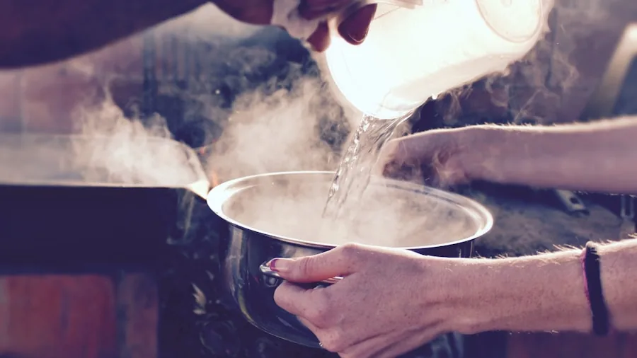 The %product_count% Best Electric Kettles 4 Person in kitchen watching kettle steam while preparing morning beverage