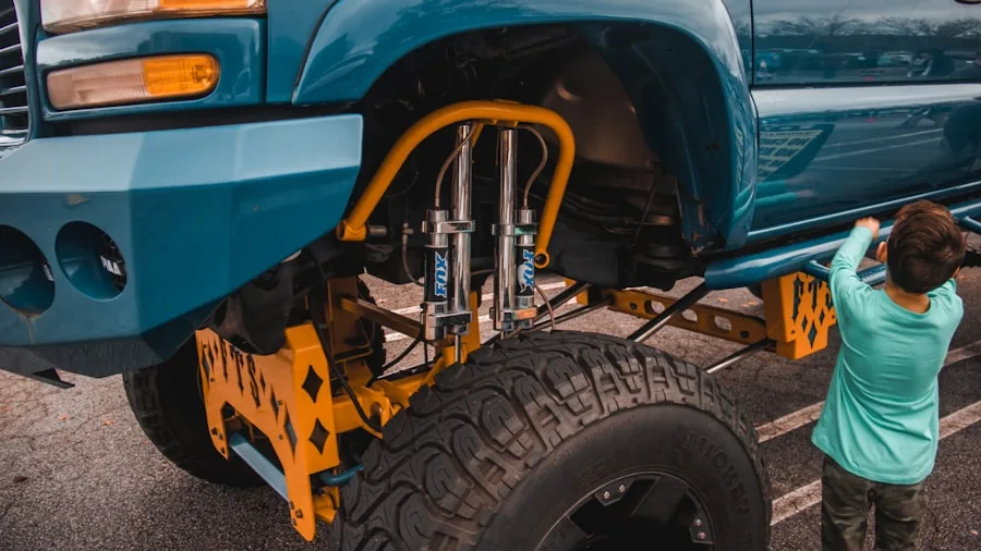 The %product_count% Best Trailer Hitches 4 Person inspecting trailer hitch connection on pickup truck in outdoor setting