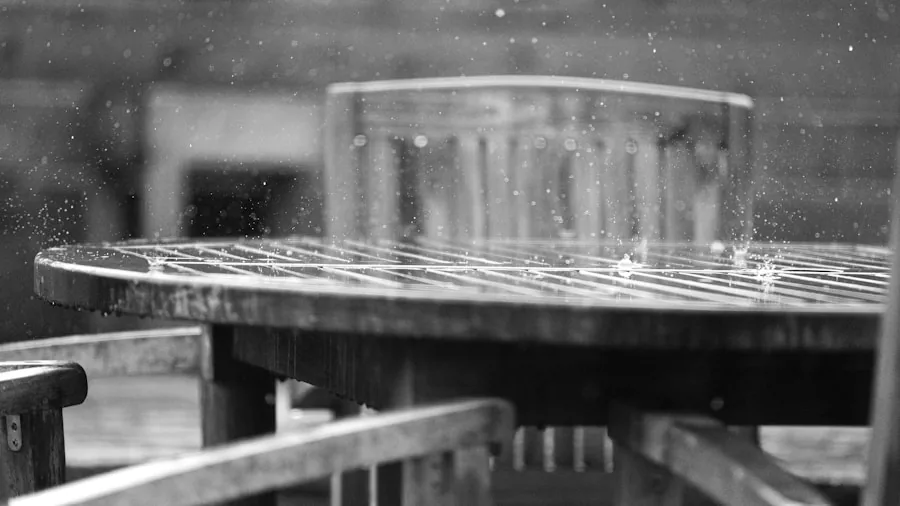 The %product_count% Best Folding Tables 2 Person inspecting weathered outdoor table surface for durability and wear resistance