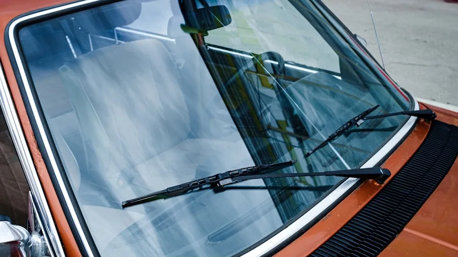 The %product_count% Best Windshield Wipers 3 Person inspecting windshield wipers on vehicle before driving