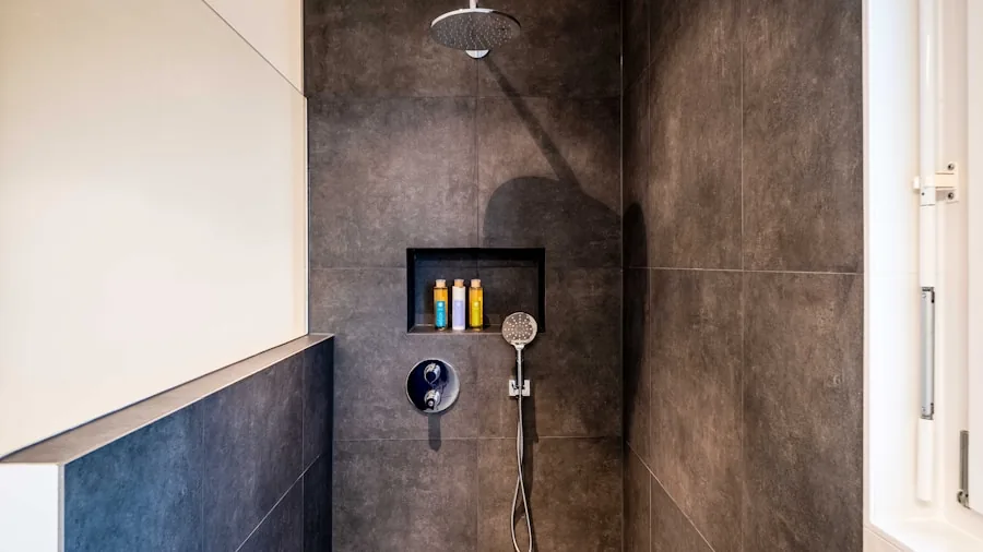 Person installing shower caddy on bathroom tile wall during home renovation