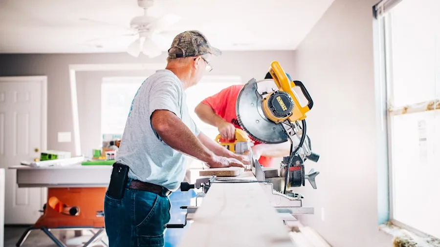 The 10 Best Air Conditioners 4 Person installing window air conditioning unit in home during renovation project