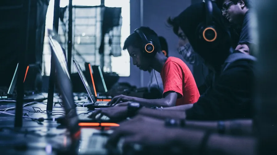 Person intensely focused while gaming on computer setup, demonstrating online gaming concentration and engagement