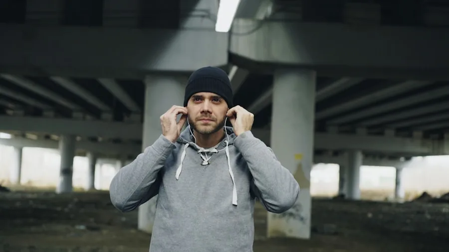 The %product_count% Best Running Headphones 2 Person jogging outdoors wearing headphones while listening to music during a run