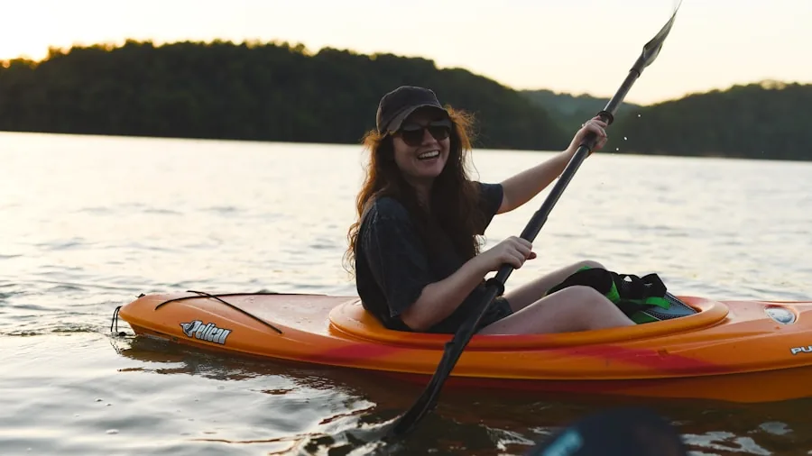 The %product_count% Best Fishing Kayaks 6 Person kayaking on peaceful lake surrounded by natural landscape and trees