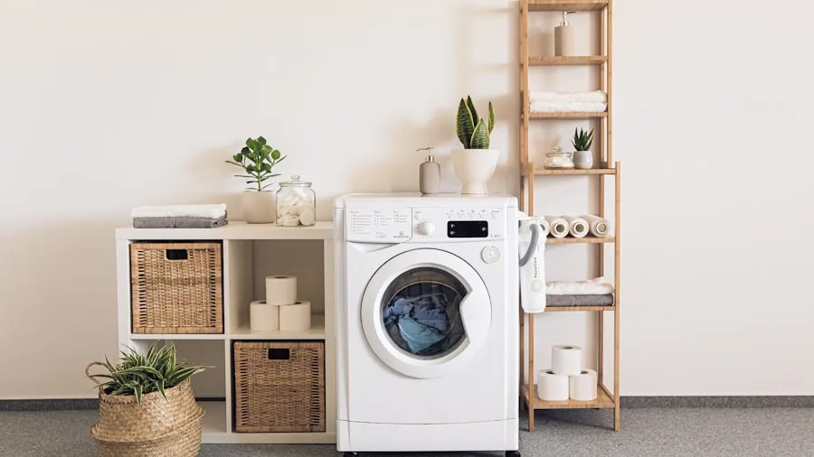 Person loading soft towels and bath mats into washing machine for weekly laundry maintenance