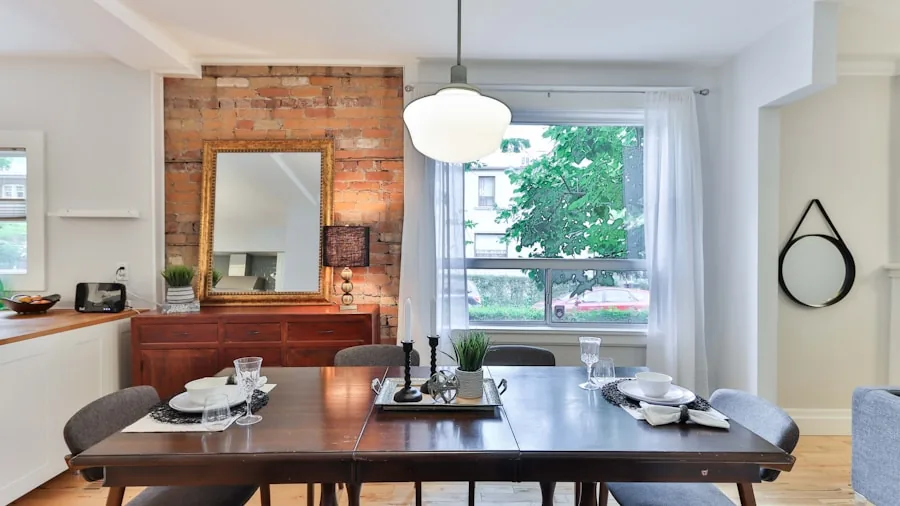 Person measuring dining room space with tape measure to plan furniture layout