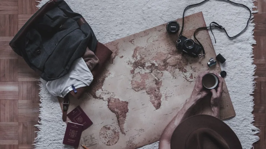 Person organizing compact items into small bag for travel, demonstrating minimalist packing approach
