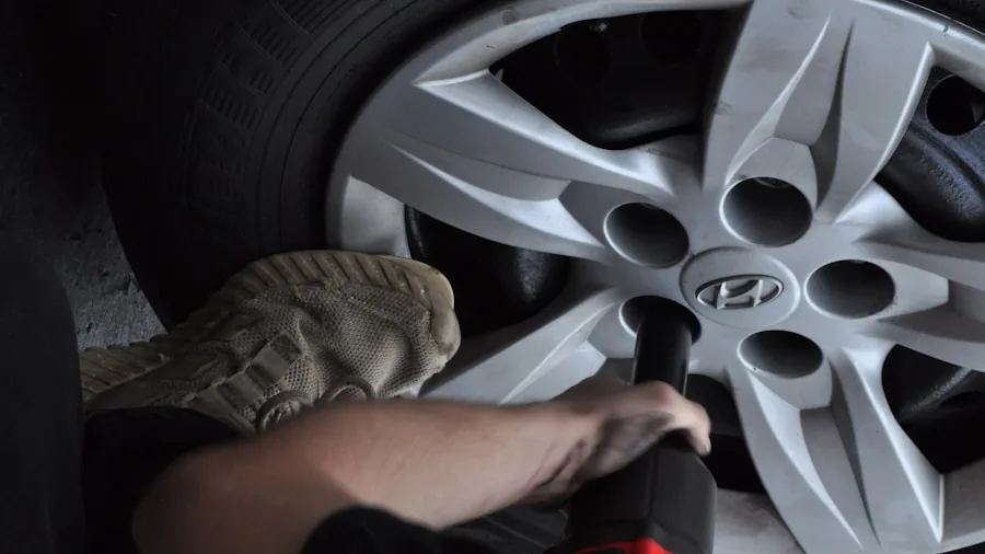 The %product_count% Best Tire Pressure Gauges 6 Person performing routine car tire pressure check and maintenance on vehicle in outdoor setting
