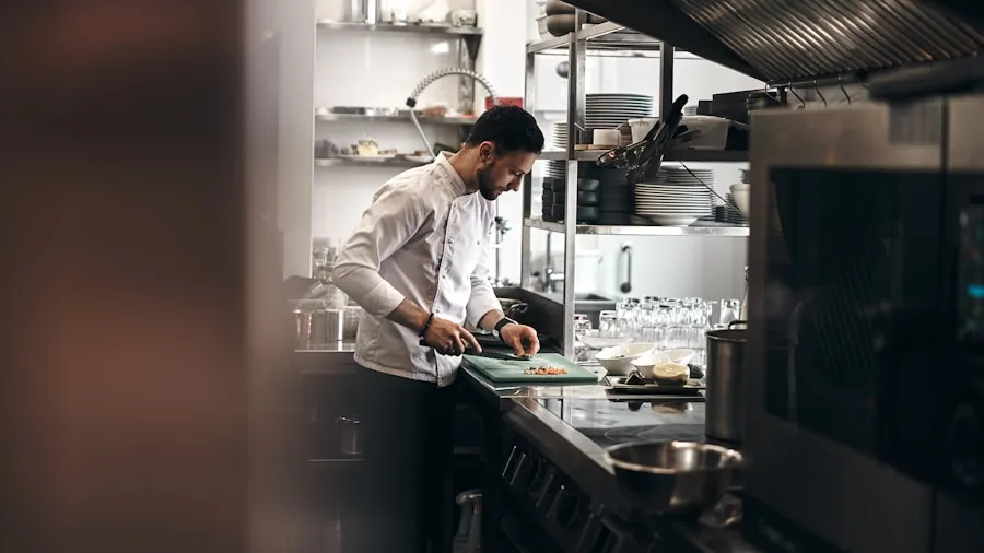 Person preparing different food types on separate cutting boards in a clean kitchen workspace