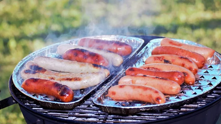 The %product_count% Best Pellet Smokers 6 Person preparing different wood types for smoking meats outdoors in natural lighting
