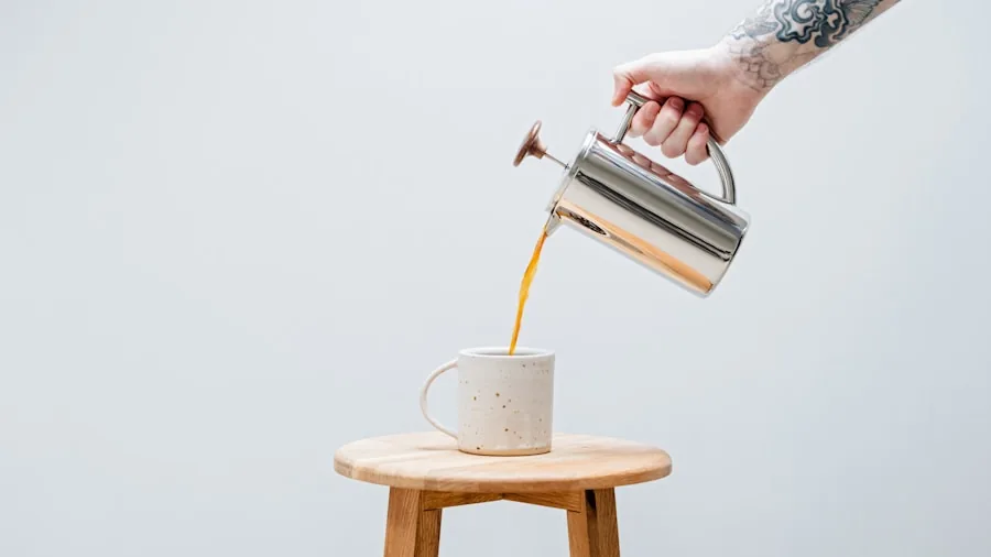 The %product_count% Best Instant Coffees 3 Person preparing instant coffee by pouring hot water into a mug in a home kitchen setting