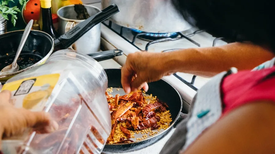 Person preparing rice meal in modern kitchen with pot and ingredients on counter