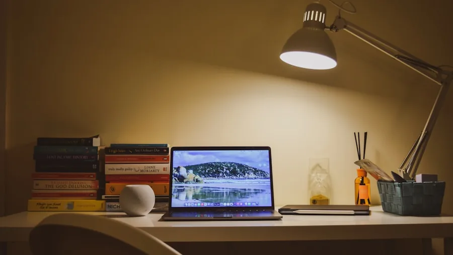 The 12 Best Table Lamps 6 Person reading at desk with warm table lamp light in cozy evening setting