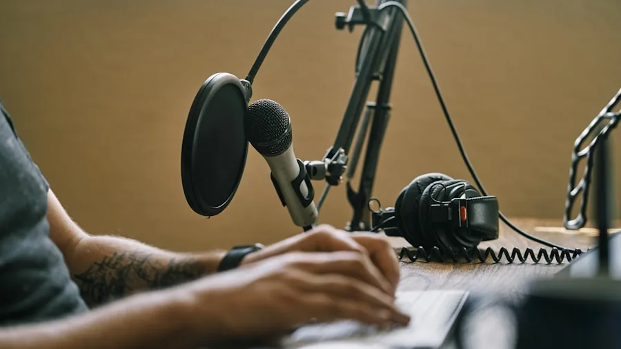 Person recording podcast in home studio with microphone and headphones