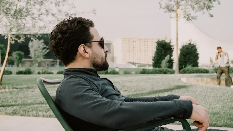 Person relaxed in outdoor chair demonstrating proper seating posture and comfort