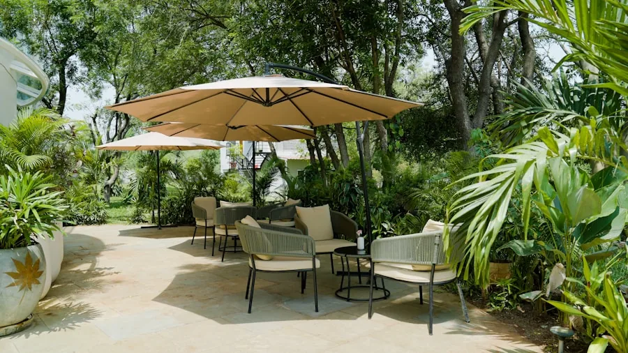 Person relaxing under durable patio umbrella on sunny residential deck
