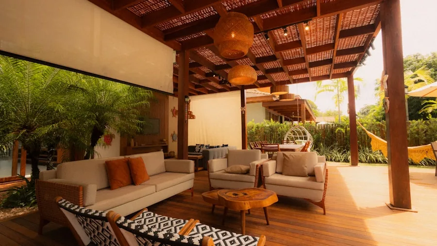 Person relaxing under patio umbrella on sunny backyard deck with natural lighting
