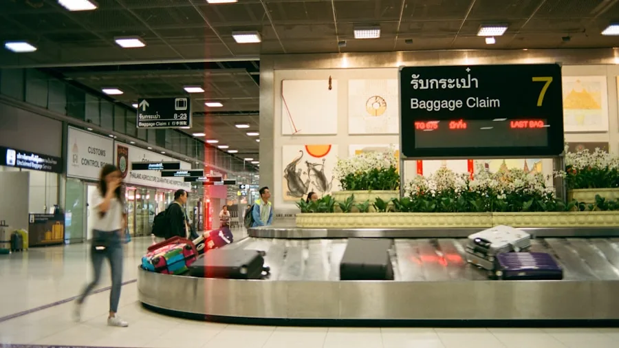 Person researching luggage options with multiple suitcases in travel setting
