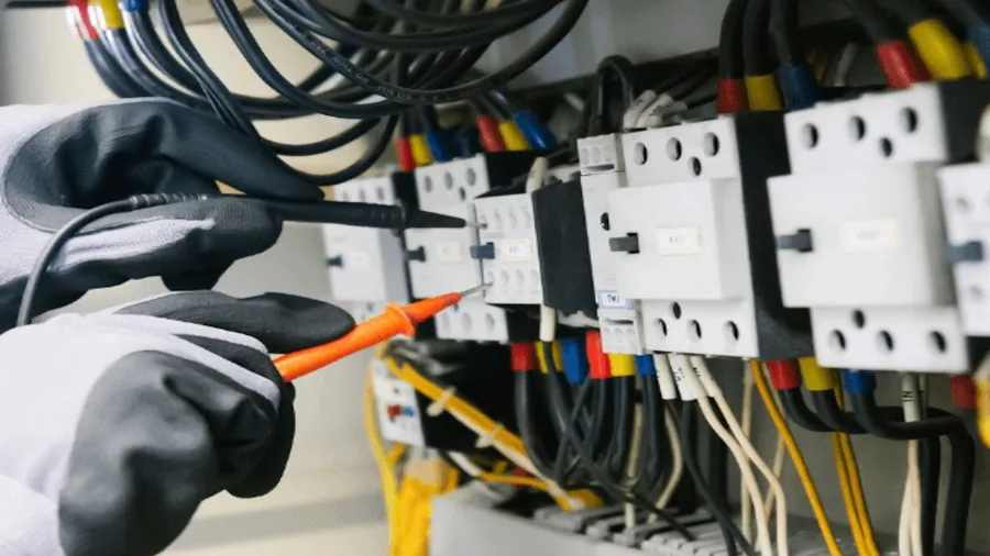 Person reviewing appliance specifications and power requirements for home energy planning