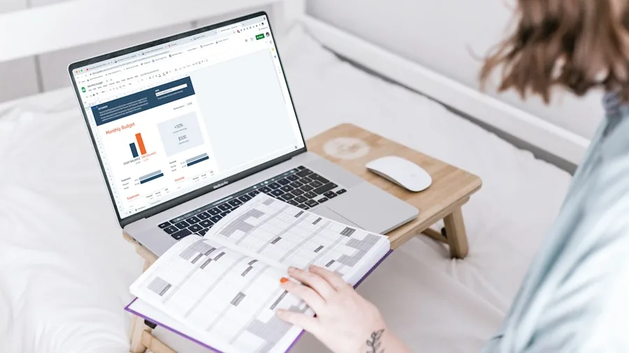 The %product_count% Best OLED Monitors 6 Person reviewing budget and financial planning documents while considering technology purchases at home desk