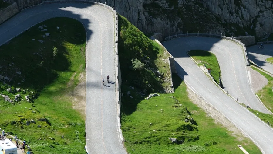 Person riding bike up a challenging hill terrain with determination and focus