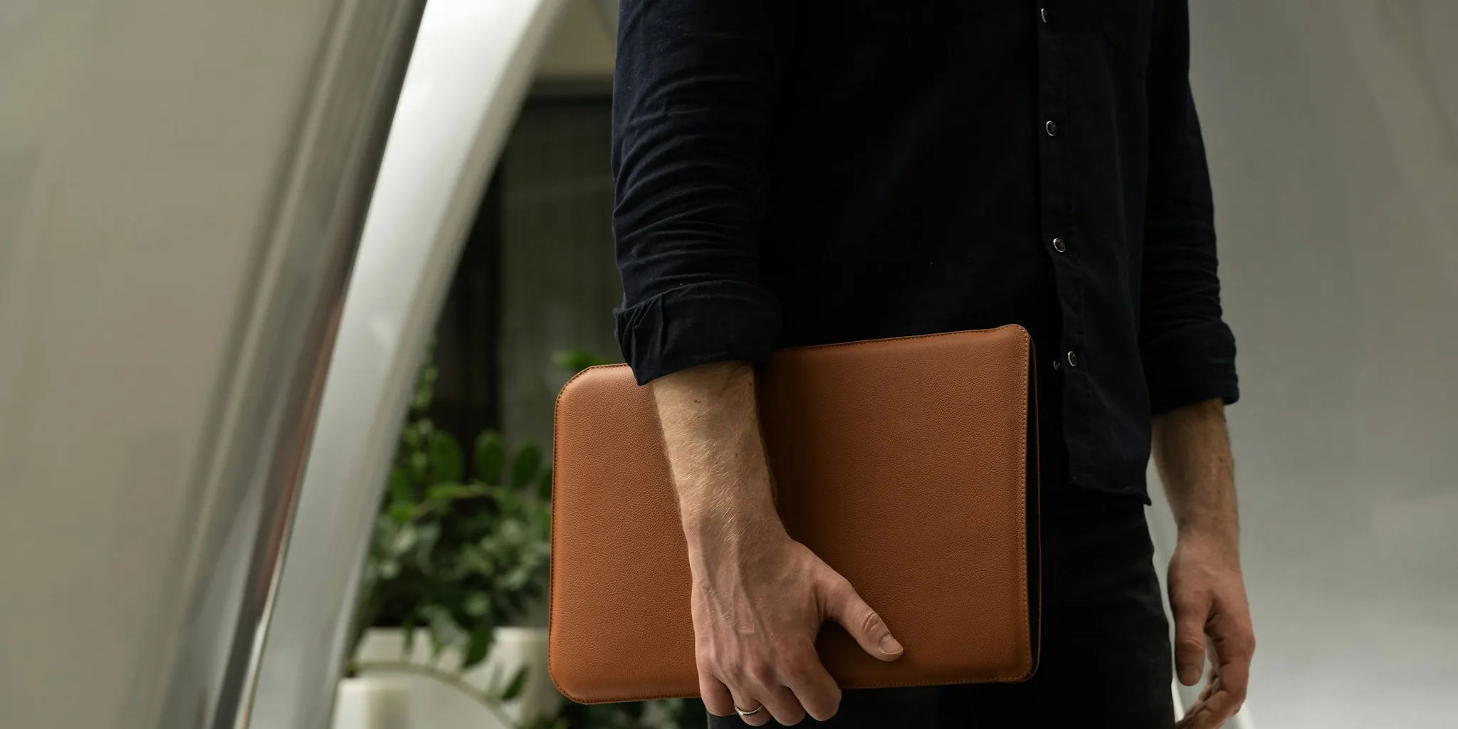 Person safely carrying protected iPhone in pocket during daily activities