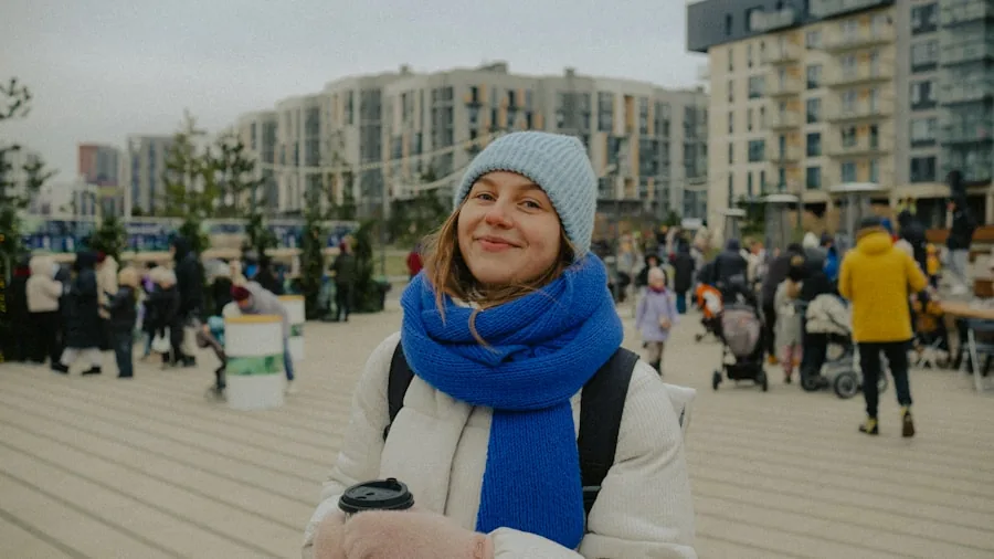 Person savoring a hot drink while enjoying a peaceful outdoor moment in natural daylight